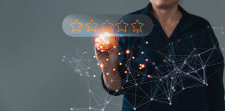 Customer service and Satisfaction concept, Online customer reviews with technology. Business people are touching virtual screen on happy Smiley face icon to give satisfaction in service.の写真素材