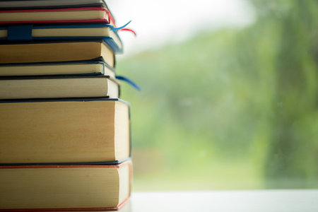 Object education green nature background with stack of ancient books or old bible, open paper book...