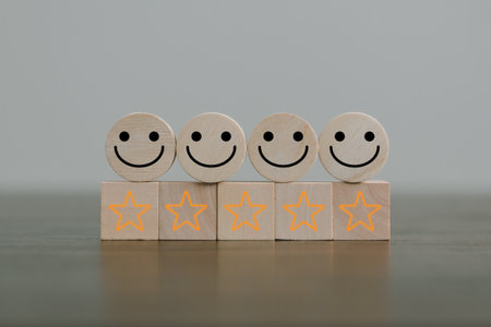 Satisfaction survey concept. Customer services best excellent business rating experience. Hand of business chooses a smile face on wood block circle. 5 Star Satisfaction. People feel great product.の写真素材