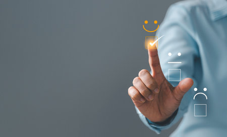 Customer service and Satisfaction concept, Excellent consumer feedback. Business people are touching virtual screen on happy Smiley face icon to give satisfaction in service. rating very impressed.の写真素材