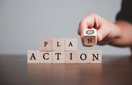 Target or goal with strategy plan-success business revenue concept. Symbols of arrows-diagrams businesses are present on wood cube. objective management, achievement startup, growth marketing idea.の写真素材