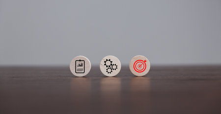 Target or goal with strategy plan-success business revenue concept. Symbols of arrows-diagrams businesses are present on wood cube. objective management, achievement startup, growth marketing idea.の写真素材