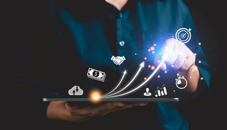 Startup concept with icon business and network connection on modern virtual interface from digital tablet. People hand touching on tablet. Developing and improving organization with modern technology.の写真素材