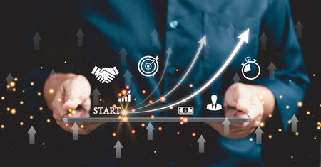 Startup concept with icon business and network connection on modern virtual interface from digital tablet. People hand touching on tablet. Developing and improving organization with modern technology.の写真素材