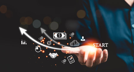 Startup concept with icon business and network connection on modern virtual interface from digital tablet. People hand touching on tablet. Developing and improving organization with modern technology.の写真素材