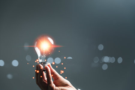 woman Hand holding Light bulb Global Internet connection. Business global internet connection application technology and digital marketing, Financial and banking, Digital link tech, big data.の写真素材