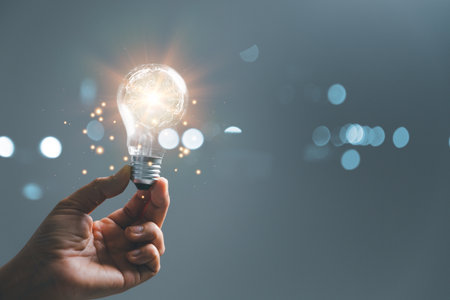 woman Hand holding Light bulb Global Internet connection. Business global internet connection application technology and digital marketing, Financial and banking, Digital link tech, big data.の写真素材