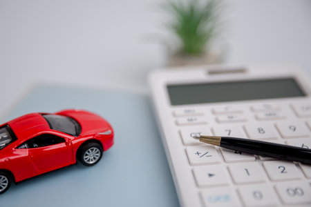 Concept of car insurance business, saving buy - sale with tax and loan for new car. Car toy vehicle with stack coin money on background. Planning to manage transportation finance costs. loan for carの写真素材