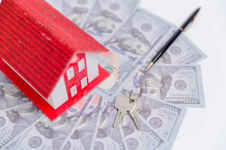 house property mortgage with cash money dollar bill on table concept of business finance, saving for buy home, investment loan, american currency, sale estate, bank payment, sell-rent real estateの写真素材