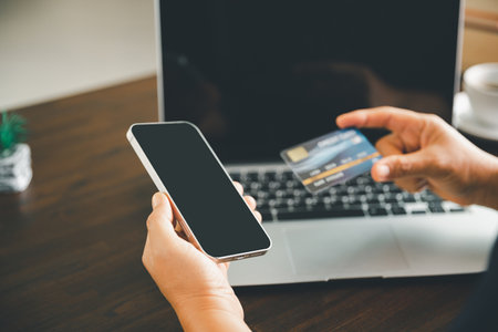 Woman hands of using online virtual app on mobile phone. Millennial guy chatting on smartphone, using banking services, reading text message, typing, shopping, making call, browsing internet.Close upの写真素材