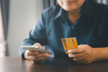 Woman hands of using online virtual app on mobile phone. Millennial guy chatting on smartphone, using banking services, reading text message, typing, shopping, making call, browsing internet.Close upの写真素材