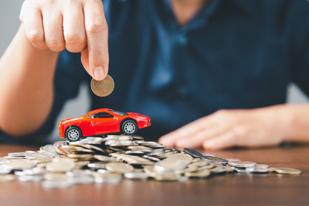 Concept of car insurance business, saving buy - sale with tax and loan for new car. Car toy vehicle with stack coin money on background. Planning to manage transportation finance costs. loan for carの写真素材