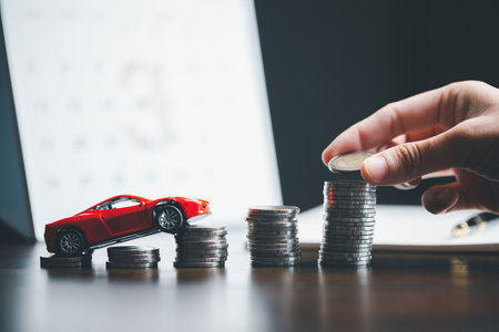 Concept of car insurance business, saving buy - sale with tax and loan for new car. Car toy vehicle with stack coin money on background. Planning to manage transportation finance costs. loan for carの写真素材