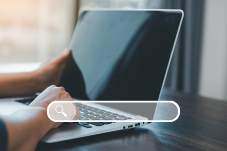 Search Engine Optimization SEO, data searching technology. business hands typing on laptop computer...