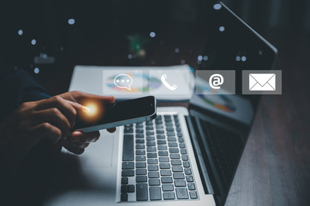 Customer support hotline contact us people connection concept. Web page online customer service technology idea. Businesswoman using smartphone with email, call phone, address, Chat message icons.の写真素材