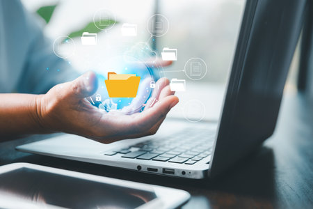 Concept of online document management technology. Businesspeople manage corporate databases through cloud, cyberspace technology and large, paperless archives of important, file and online storage.の写真素材