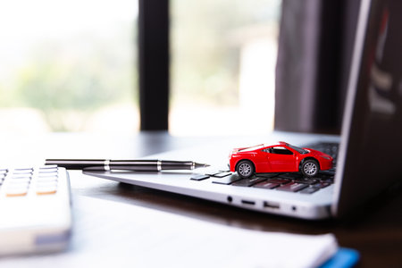 Car dealer business woman signing car insurance document or lease paper. Planning to manage transportation finance costs. Concept of car insurance business, saving buy with tax and loan for new car.の写真素材