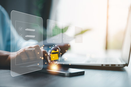 Concept of online document management technology. Businesspeople manage corporate databases through cloud, cyberspace technology and large, paperless archives of important, file and online storage.の写真素材
