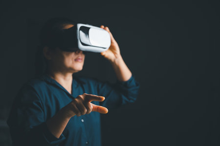 Woman with glasses of virtual reality. Future technology concept. Metaverse technology concept. VR virtual reality goggles. Futuristic lifestyle. female using virtual reality headset at home office.の写真素材