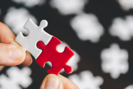 Business woman person hand holding puzzle piece idea for strategy and solution. Closeup part of two jigsaw connect together. Concept of join cooperation success teamwork-problem corporate teamの写真素材