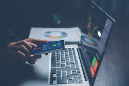 Investors are analysis growth charts and investing in stock market. Planning and strategy stock market trader or businesswoman online working in home. Finance digital data and technology concept.の写真素材