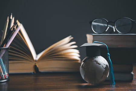 Graduation cap with Earth globe. Concept of global business study, abroad educational, Back to School. Education in Global world, Study abroad business in universities in worldwide. language studyの写真素材