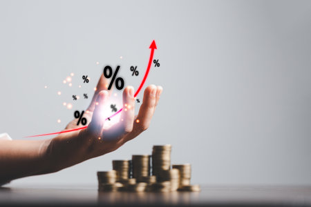 Business woman hand and stack coins money with up arrow and percentage symbol of Interest rate financial and mortgage rates. Icon percentage symbol and arrow pointing up.の写真素材