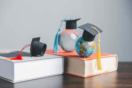 Graduation cap with Earth globe. Concept of global business study, abroad educational, Back to School. Education in Global world, Study abroad business in universities in worldwide. language studyの写真素材