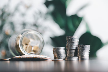 Saving money, glass jar saving, business saving money concept, business economy idea, selective focus. Financial and business, Management money retire, tax.の写真素材