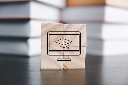 Success and necessary skills in graduation or education. Knowledge and teaching. Wooden cubes with graduation and education symbols linked. education concept. Creative idea and innovation.の写真素材