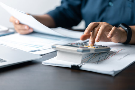 Business Data Analysis on Laptop: Financial Charts, Graphs, Reports for Successful Planning and Strategy. Professional Workplace: Analyzing Business Data, Charts, Graphs for Strategic Decision Makingの写真素材