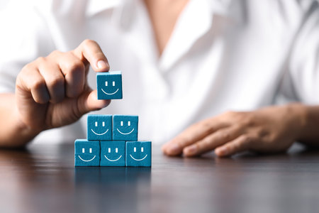 Business Success and Customer Satisfaction Concept: Wooden Cube of Achievement, Innovation, and Collaboration. Motivation and Growth: Unlocking Success with Wooden Cube of Teamwork, Strategy.の写真素材