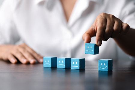 Business Success and Customer Satisfaction Concept: Wooden Cube of Achievement, Innovation, and Collaboration. Motivation and Growth: Unlocking Success with Wooden Cube of Teamwork, Strategy.の写真素材