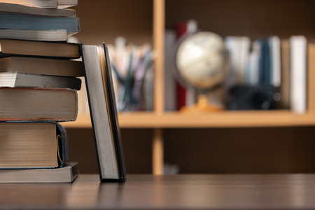 Education learning concept. Book in library with old open textbook, stack piles of literature text...