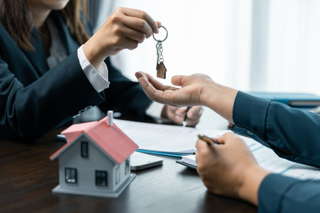 Banks approve loans to buy homes. Real estate agents explain the document for customers who come to contact to buy a house, buy or sell real estate concept.の写真素材