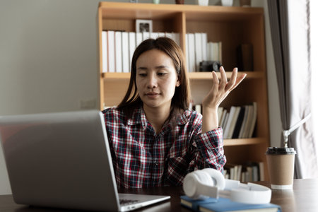 Asian woman student study online with skype teacher, happy young woman learn language listen lecture...