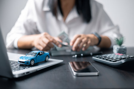 Concept of car insurance business, saving buy - sale with tax and loan for new car. Car toy vehicle with stack coin money on background. Planning to manage transportation finance costs. loan for carの写真素材