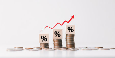 Inflation concept, red graph arrow, Percentage sign on wooden cube with rows of coins in idea for...