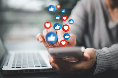 Person used their smartphone to comment, like posts on social media, embracing digital technology...