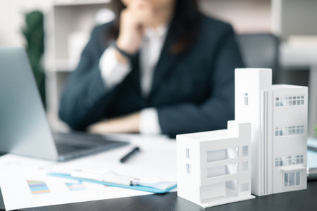 Person invested in the property market for their home through a mortgage loan, navigating the...