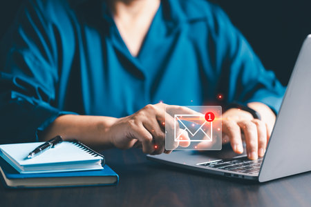Company uses email marketing to send out engaging newsletters and promotional content through electronic mail in cyberspace, reaching customers online. email, mail, content, marketing, newsletter.の写真素材