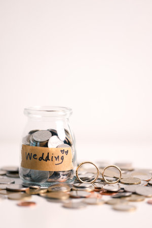 Save money for a wedding, wise to manage your finance by investing in gold, utilizing banking services, and understanding the broader economy and currency business, even down to every last coin.の写真素材