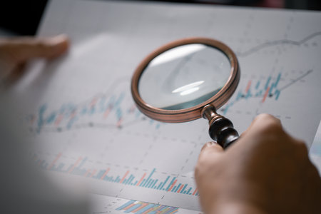 Person in charge of finance prepared report that included detailed analysis of accounting data, presented in both chart and graph formats. datum, analysis, graph, business, accounting, report, chart.の写真素材