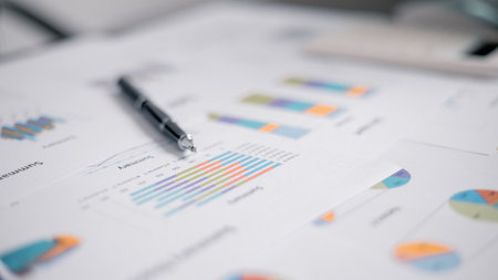 Person in charge of finance prepared report that included detailed analysis of accounting data, presented in both chart and graph formats. datum, analysis, graph, business, accounting, report, chart.の写真素材