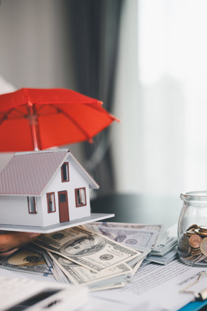 Concept business house finance protection office plan investment buy sell home ensuring idea financial security. residence agent hand protect purchase insurance and secure favorable loan deal.の写真素材