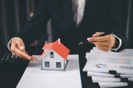 Concept business house finance protection office plan investment buy sell home ensuring idea financial security. residence agent hand protect purchase insurance and secure favorable loan deal.の写真素材