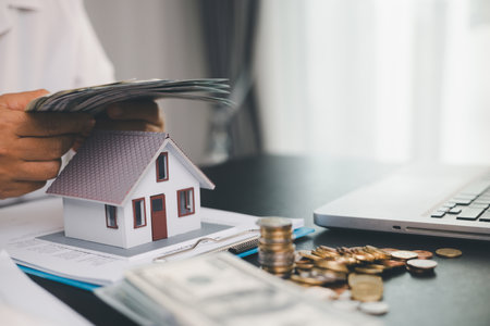 Concept business house finance protection office plan investment buy sell home ensuring idea financial security. residence agent hand protect purchase insurance and secure favorable loan deal.の写真素材