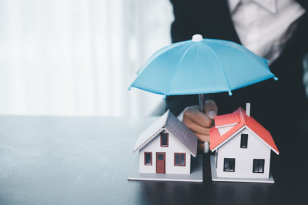 Concept business house finance protection office plan investment buy sell home ensuring idea financial security. residence agent hand protect purchase insurance and secure favorable loan deal.の写真素材
