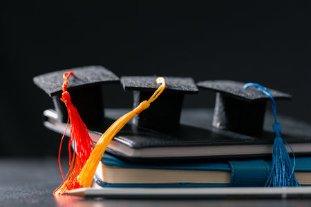 Concept education is business scholarship essential idea globalization, mortarboard students learn and study in universities and colleges master knowledge save involves financial management diplomaの写真素材