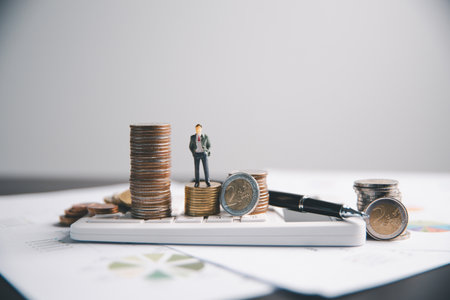 Financial calculate accountant blur background close up on calculator with graph chart banner bank office desk. Finance Concept tax banking money expense accounting budget businessman use calculator.の写真素材